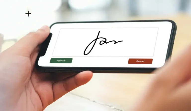 una mano che firma digitalmente su uno schermo